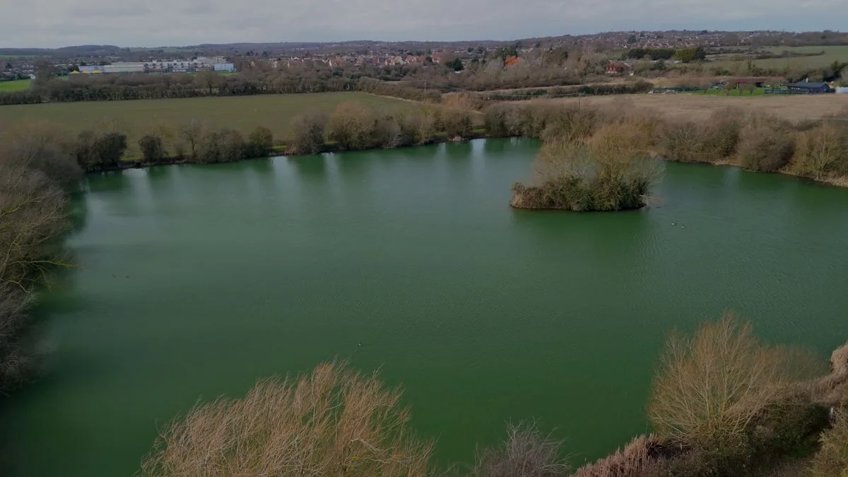 Aerial view of the lake and woodland at the RAW Learning site in Rochford